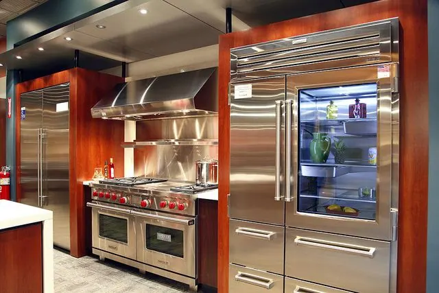 Wolf professional range with red knobs and dual-stacked burners